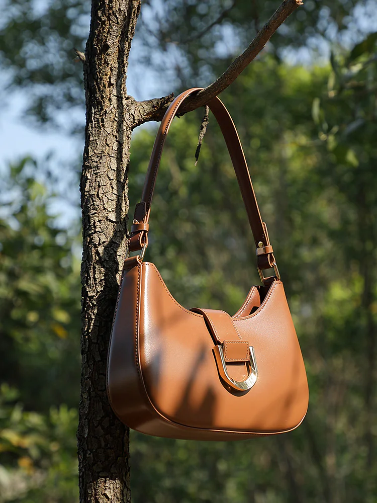 Curved Leather Baguette — BODA leather handbag manufacturing