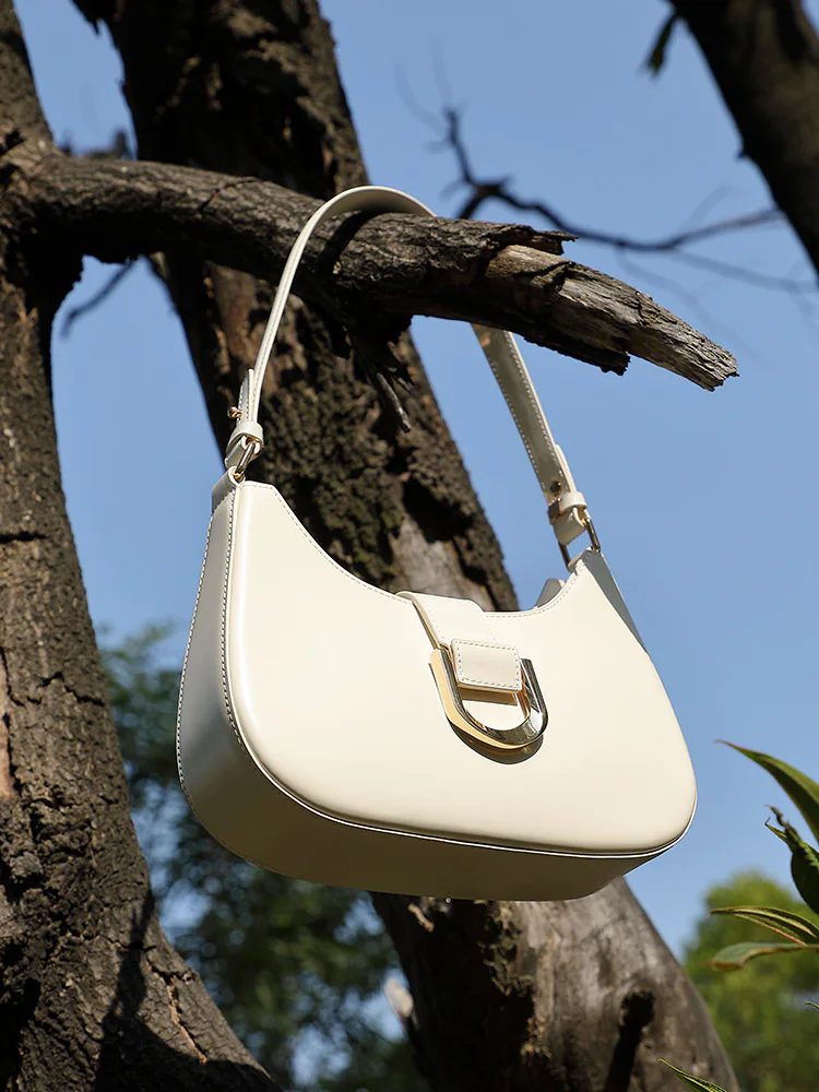 Curved Leather Baguette — BODA leather handbag manufacturing