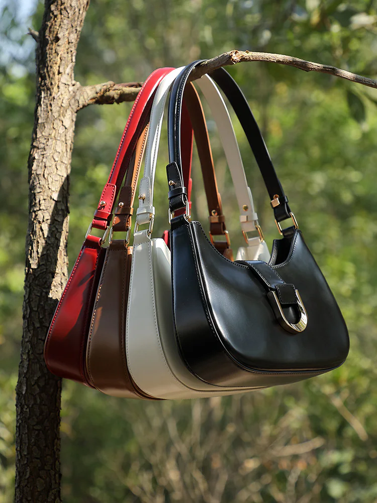 Curved Leather Baguette — BODA leather handbag manufacturing